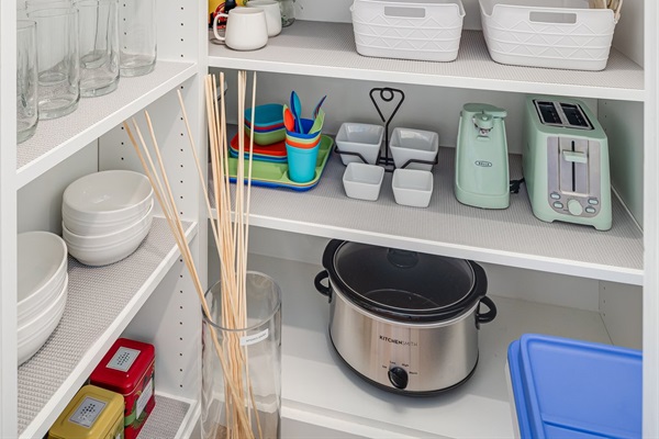 In the pantry you'll find glassware and a few staple appliances like a toaster, can opener and a crockpot. Also in the pantry child dishware and a complimentary started s'mores kit.