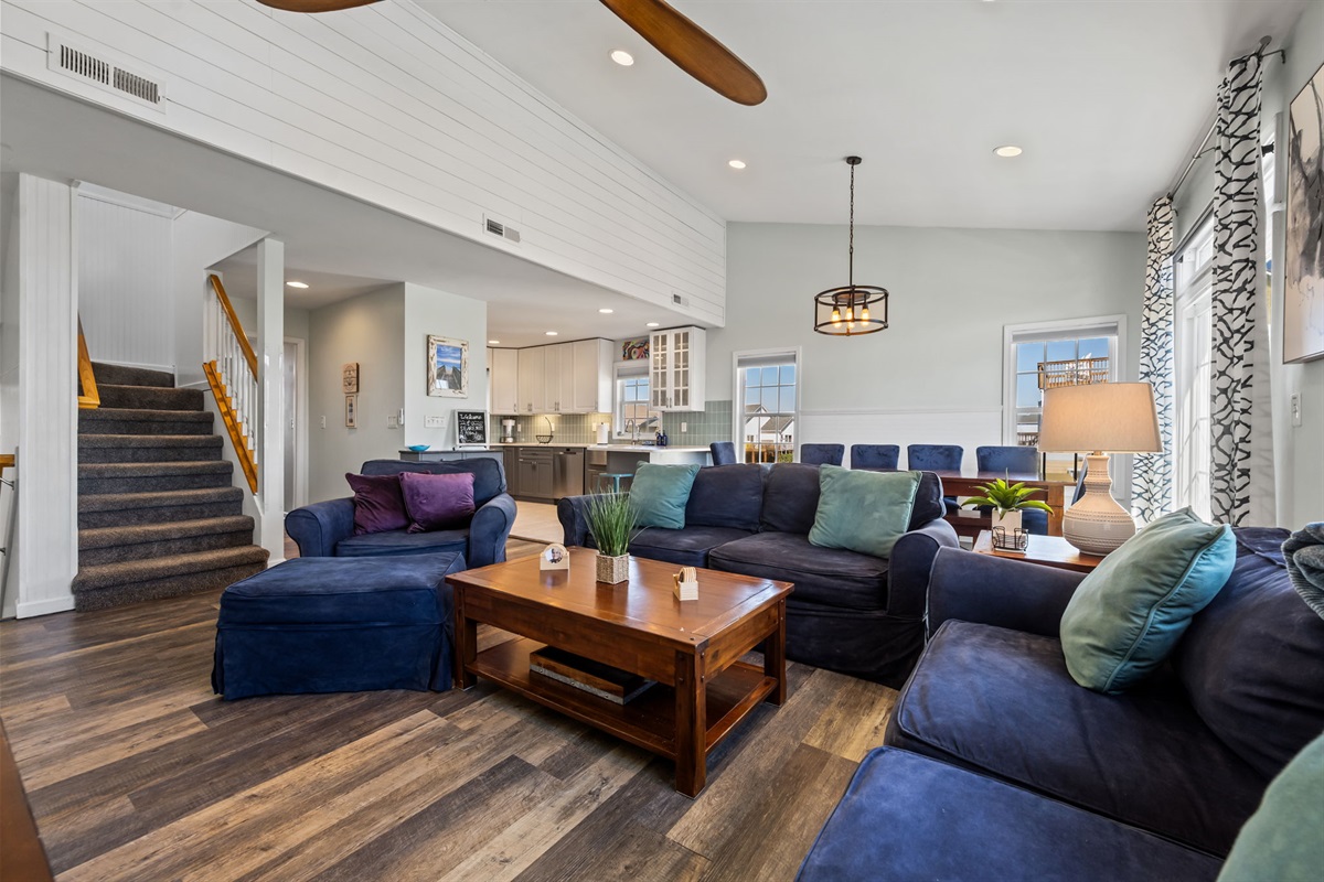 Spacious open-concept living area with comfortable seating for the family to gather, relax, and unwind after beach adventures. Be together without feeling crowded!
