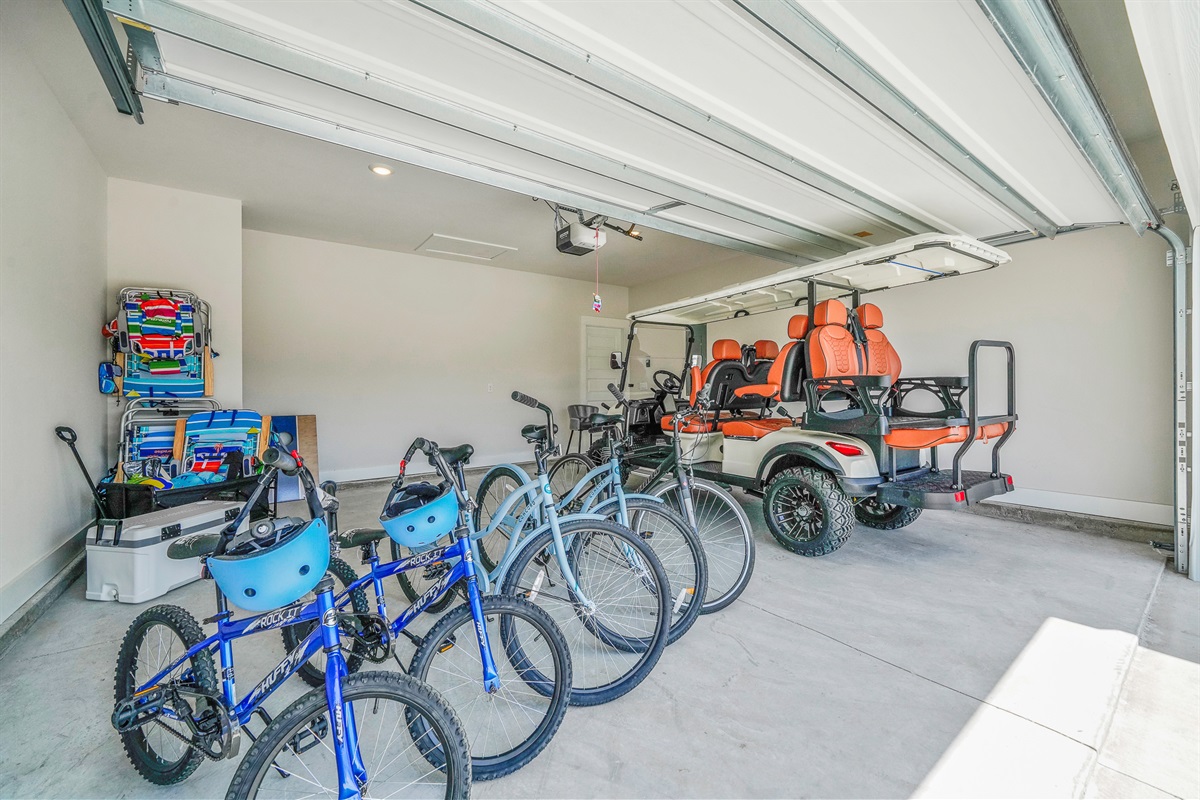 Enjoy a large garage featuring beach essentials and a brand-new 6-seater golf cart to explore the town and nearby beach.