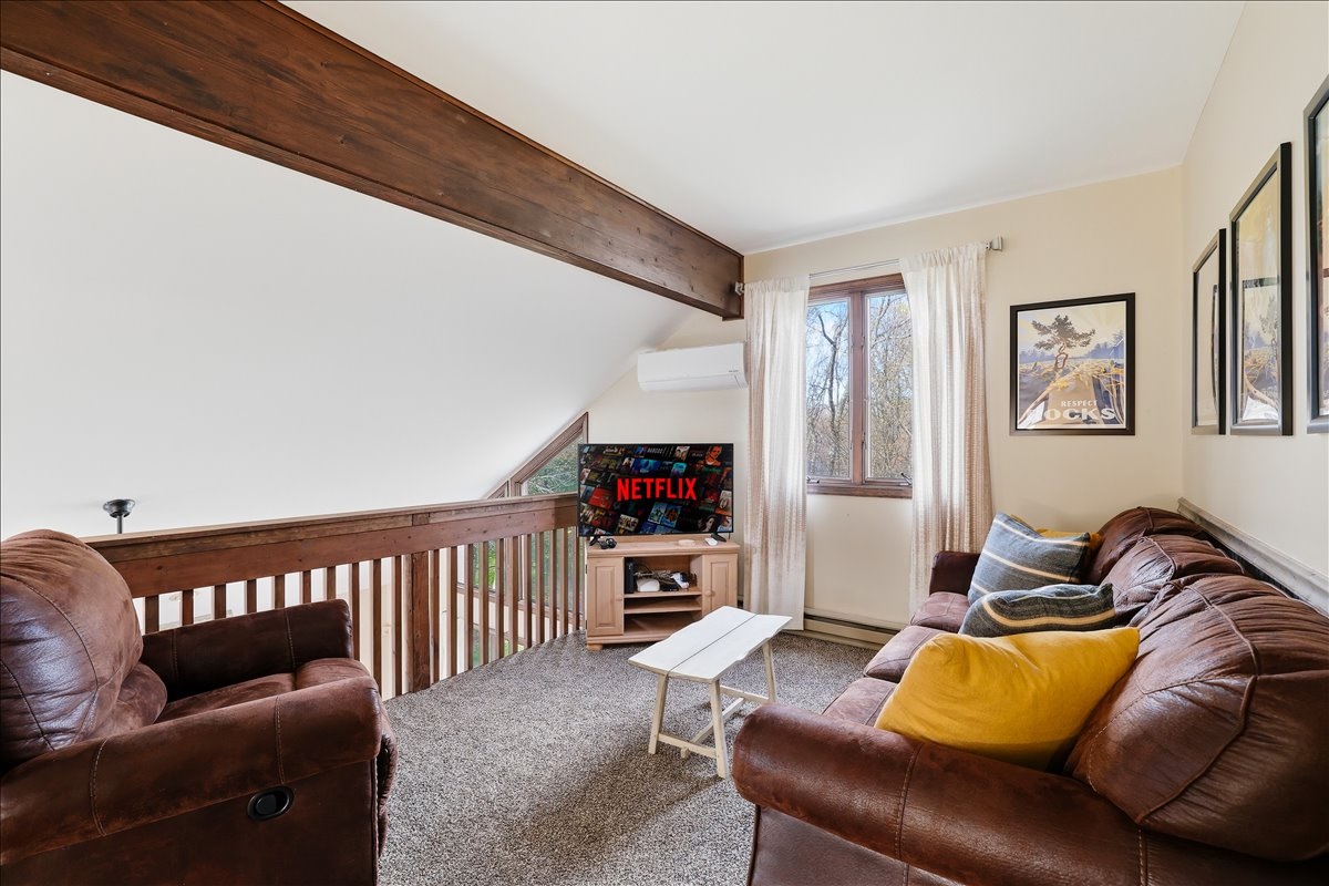 Upstairs, the cozy loft lounge offers a fun bonus space with a TV and sleeper sofa