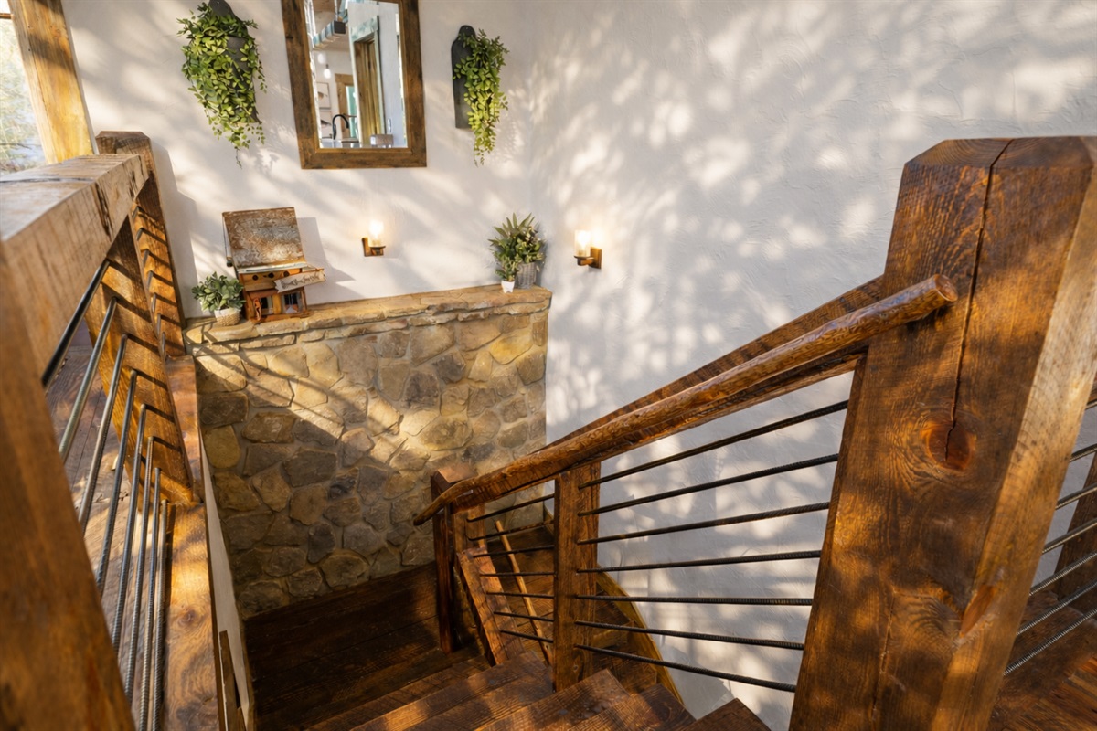 Rustic elegance meets thoughtful design &mdash; this beautifully crafted staircase is just one of the charming details that make this mountain cabin feel like home.