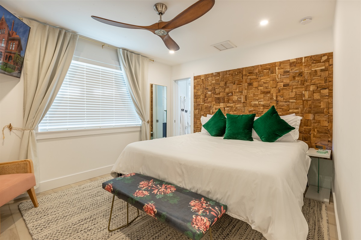 Bedroom Oasis: Luxuriate on a plush bed adorned with vibrant accents and a tropical vibe!