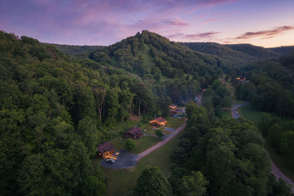 🏕 The cabins from above at dusk — tucked into the heart of Denton Hill State Park.