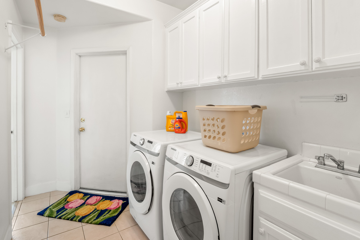 Enjoy the convenience of a dedicated laundry room equipped with a full-size washer and dryer, making it easy to keep clothes fresh during extended stays and family vacations.