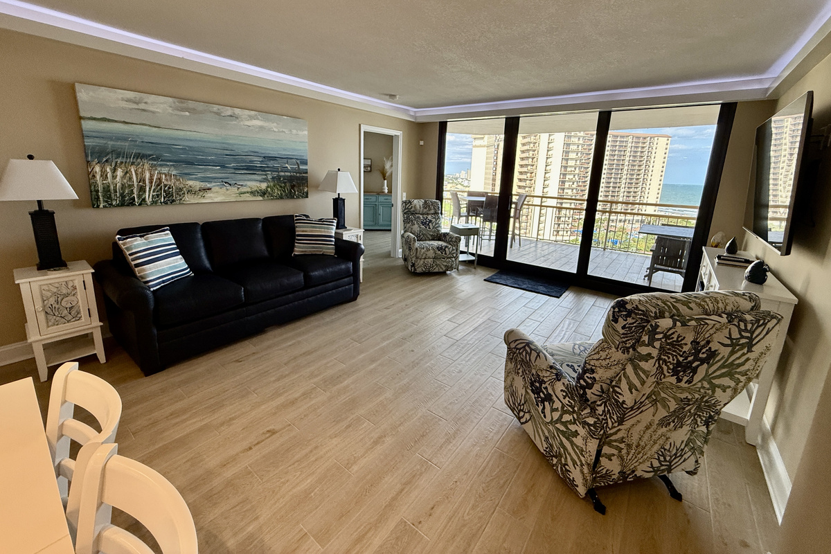 Ocean View Living Room with Remote Controlled Shades and 65" Smart TV