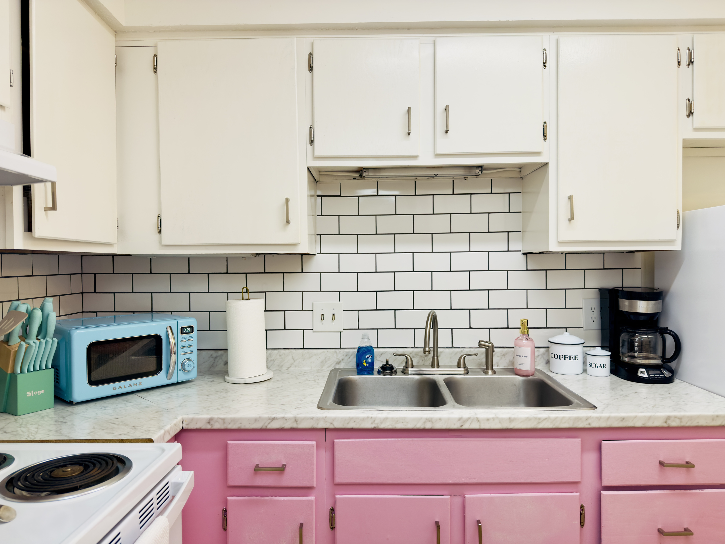 Kitchen with coffee, creamer, and sugar provided.