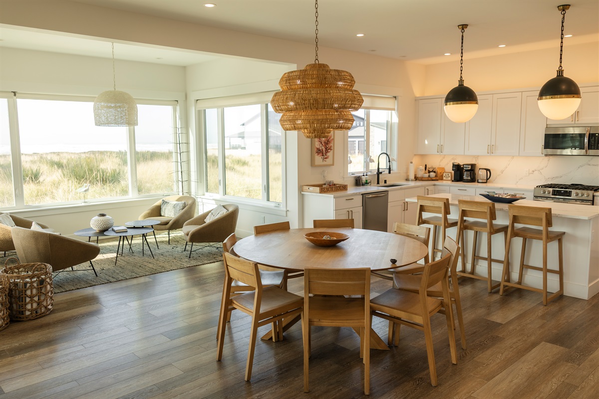 {Living Room} Bright, airy, and beautifully furnished with designer pieces and coastal décor — all framing the ocean view.