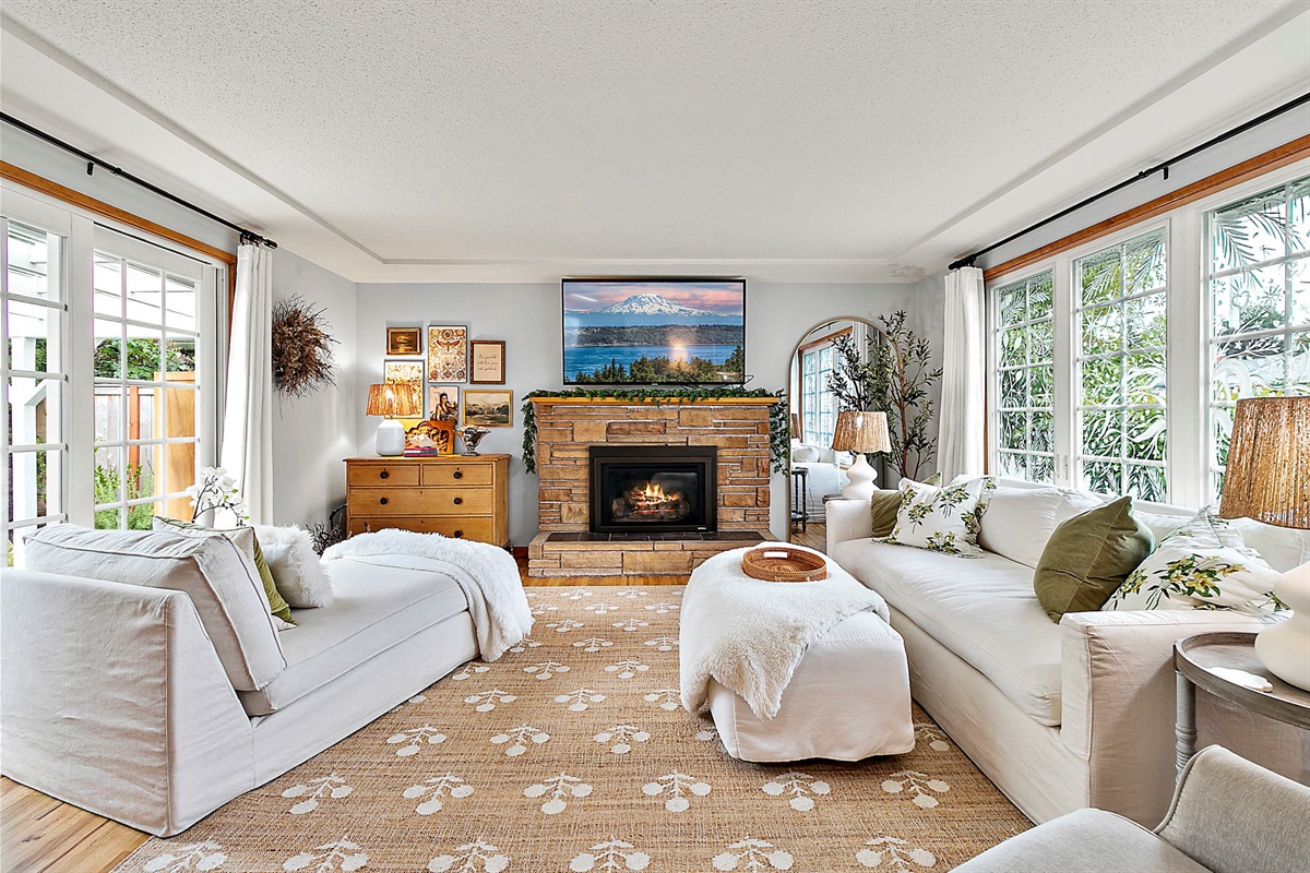 Light filled, cozy living area greets you into the home!