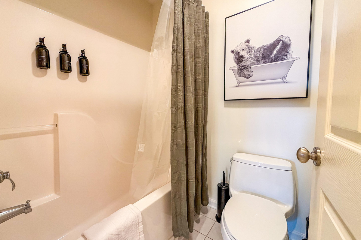 A combination tub/shower in the upper level bathroom. We proudly provide Paya organics body wash and shampoo for our guests.