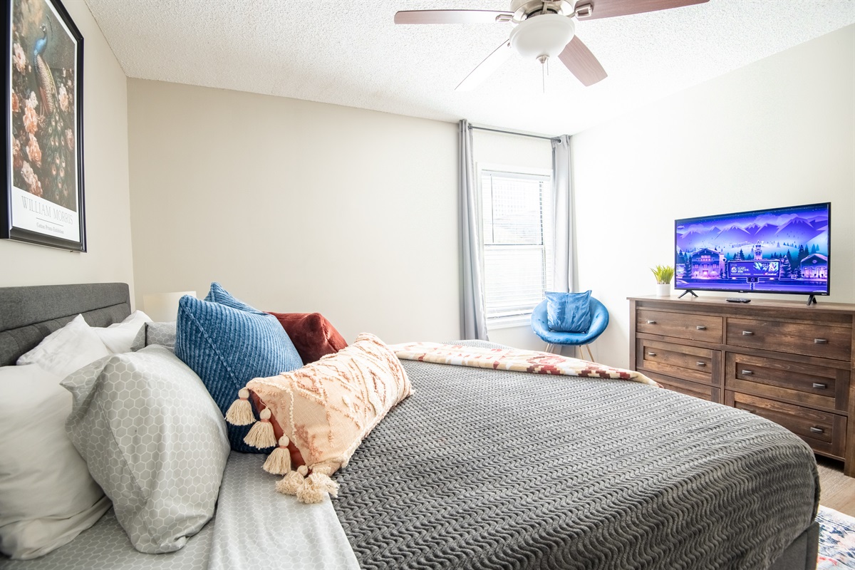 This cozy king bedroom in Unit A is perfect for relaxing and unwinding - designed with intention and movie nights in mind!