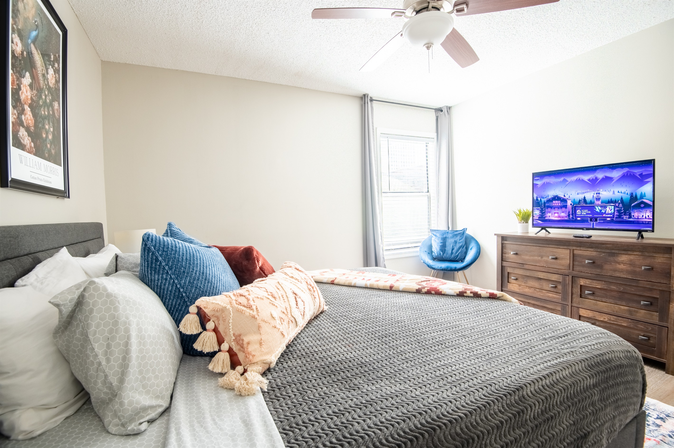 This cozy king bedroom in Unit A is perfect for relaxing and unwinding - designed with intention and movie nights in mind!