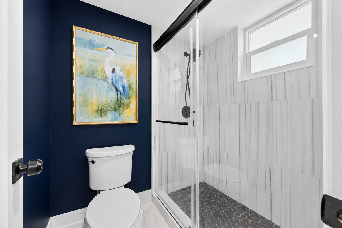 Private toilet room and walk-in shower.