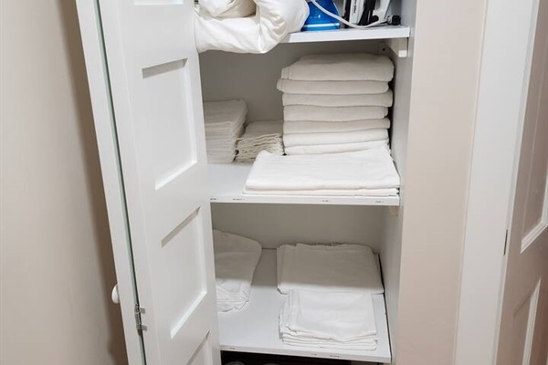 Fully stocked linen closet includes everything needed for the two downstairs bedrooms. Also includes extra sheets, pillowcases, blankets, toilet paper, soaps, shampoo, for you stay. 