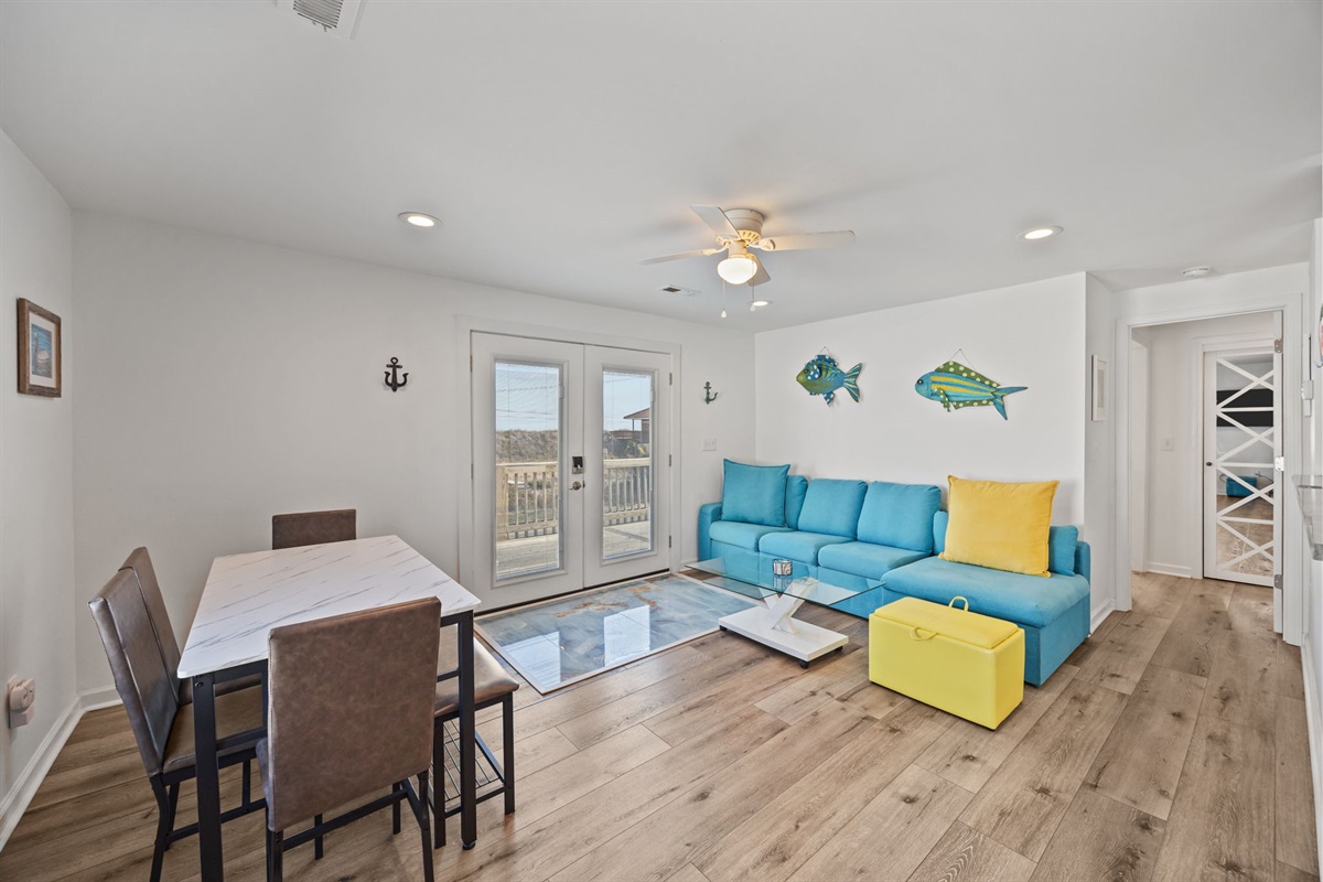 Simple, comfortable dining space just off the living area with easy balcony access
