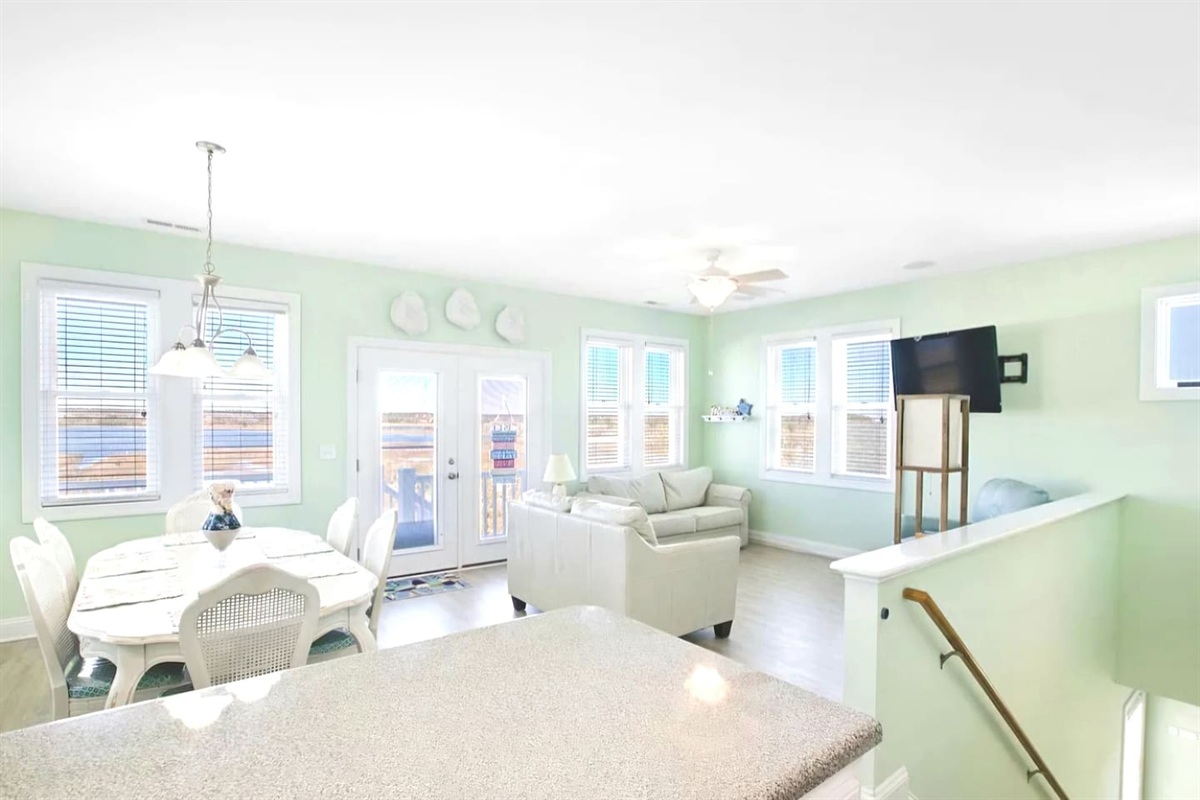 balcinies front, back, top and bottom!
Sound water views all around the living and dining room areas. Back door leads to upper deck, with stairs to the lower deck and backyard