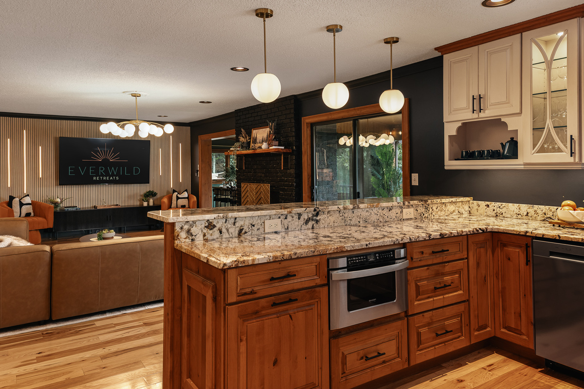 {Kitchen} The oversized island gives your group plenty of room to prep meals, pour drinks, and gather without missing any of the fun.