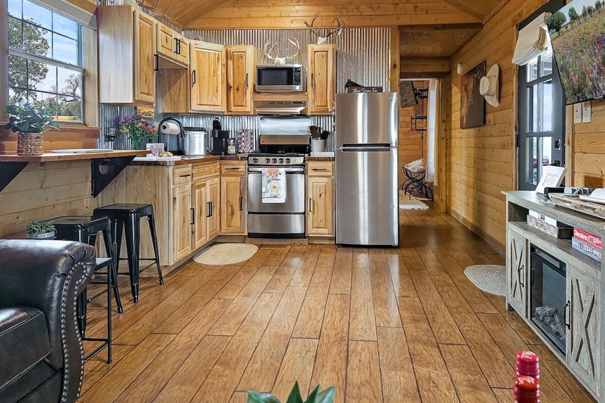 Whip up delightful meals in this charming, fully-equipped kitchen with modern stainless steel appliances – a joy for any culinary enthusiast looking for a home-away-from-home experience!

