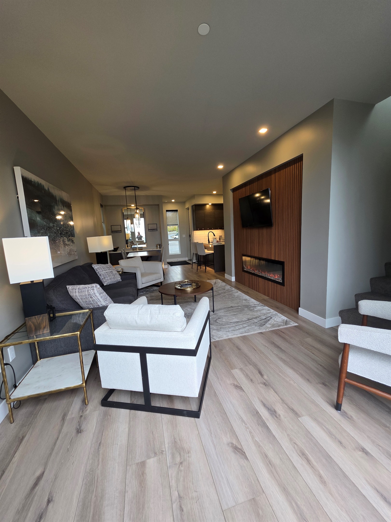 View thru living room. Open concept. Queen pullout couch.