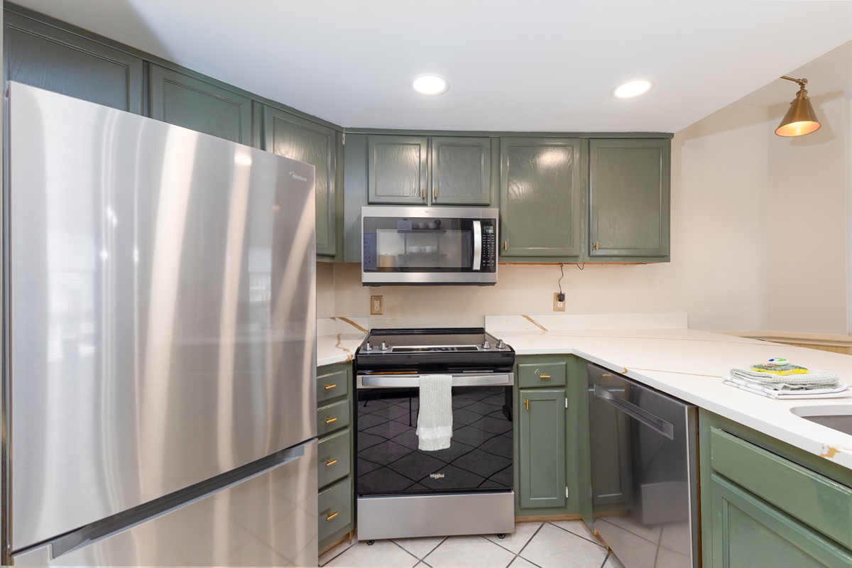 Stainless steel appliances and cabinets offer a sleek look