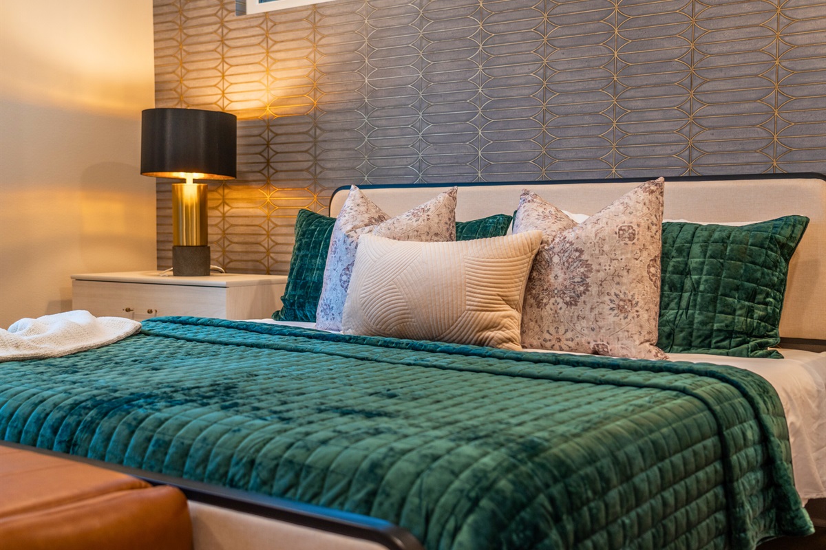 Elegant wallpaper and modern decor add a touch of sophistication and chic style to the room.