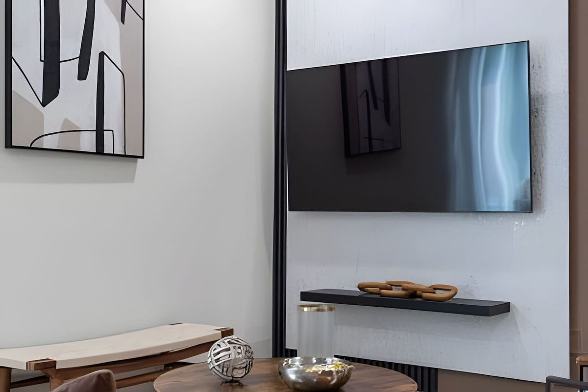 Enjoy a modern living experience with this elegant TV setup.