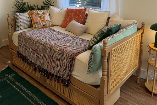 Twin day bed with pillows and linens provided