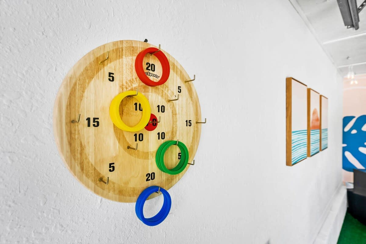 The dartboard on the lounge wall, with the ring toss just below it. Between this, the cornhole and the games in the corner, nobody in your group will be short of something to argue about after dinner.
