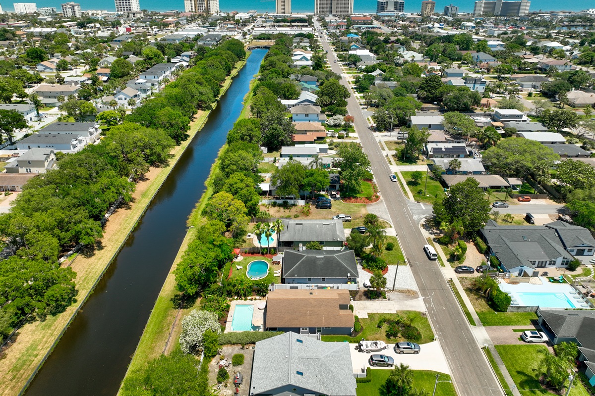 The home is located on a canal with a walking path to parks and the beaches.