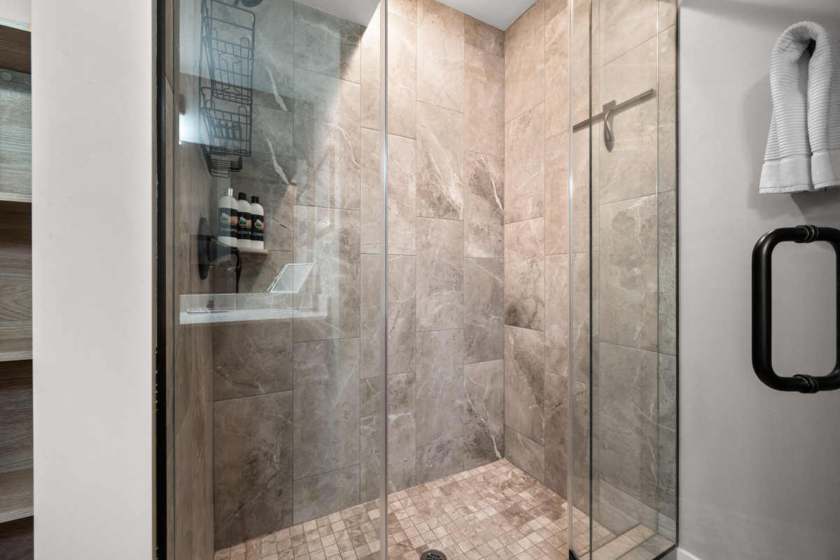 Refresh after a day on the slopes or trails in the spacious walk-in shower with beautiful tilework and premium fixtures.
