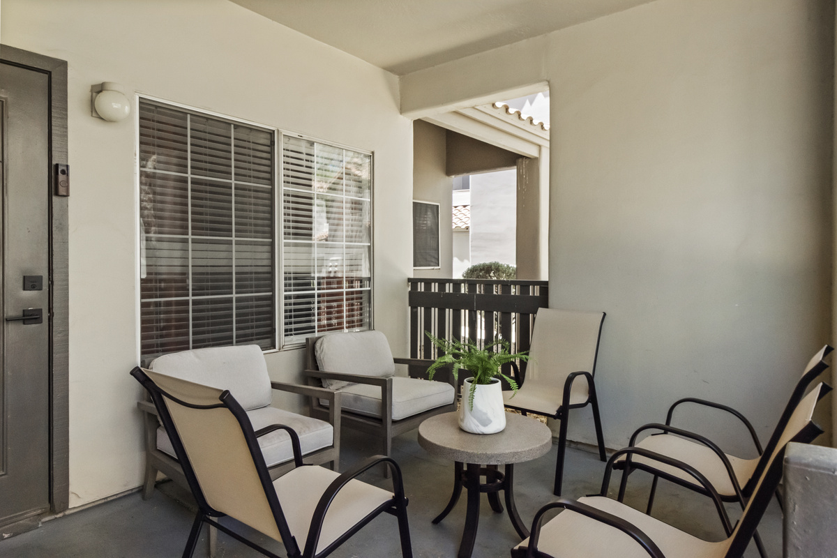 Enjoy fresh air on the furnished patio with seating.