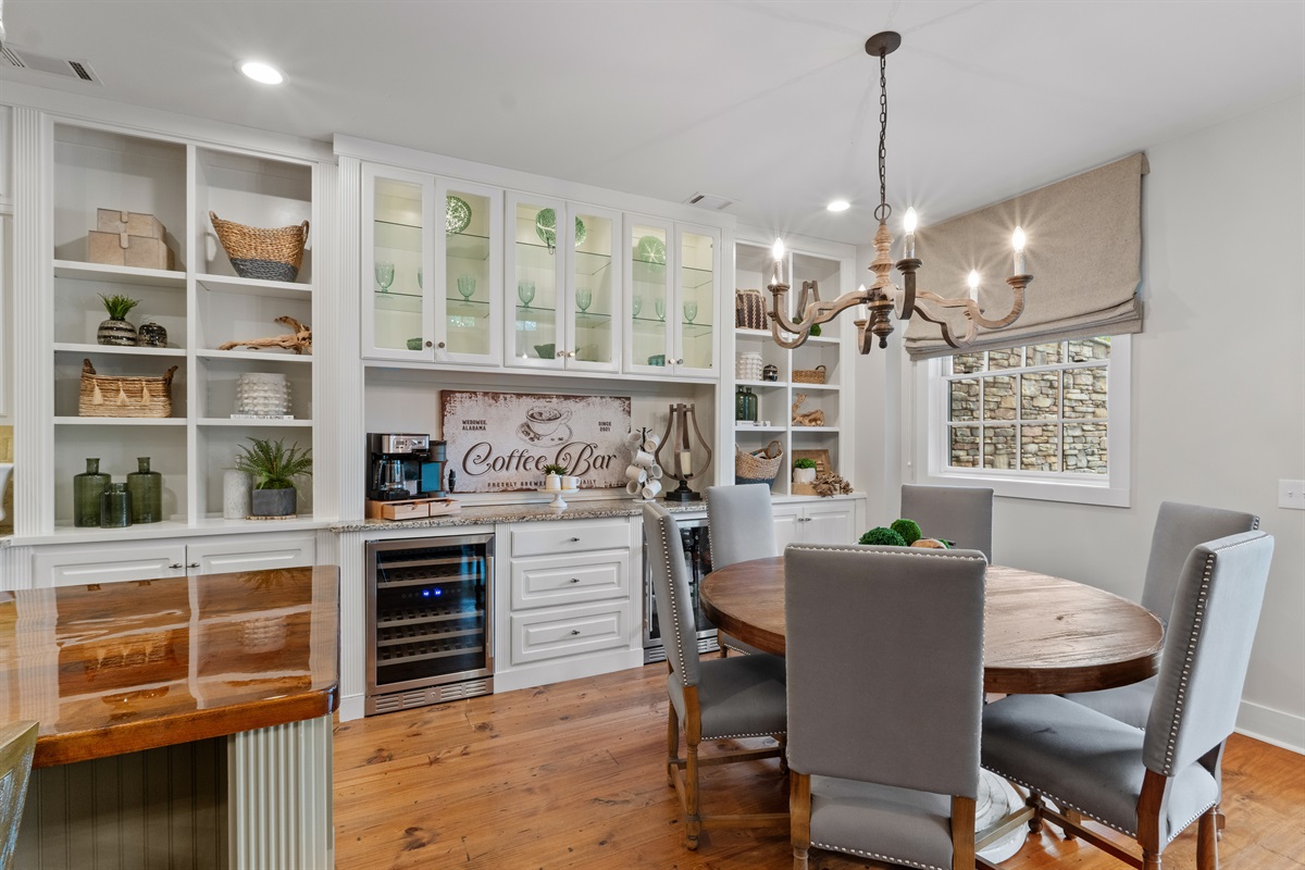 Enjoy a coffee bar with a wine fridge and beverage fridge, perfect for morning brews, evening drinks, and easy entertaining.