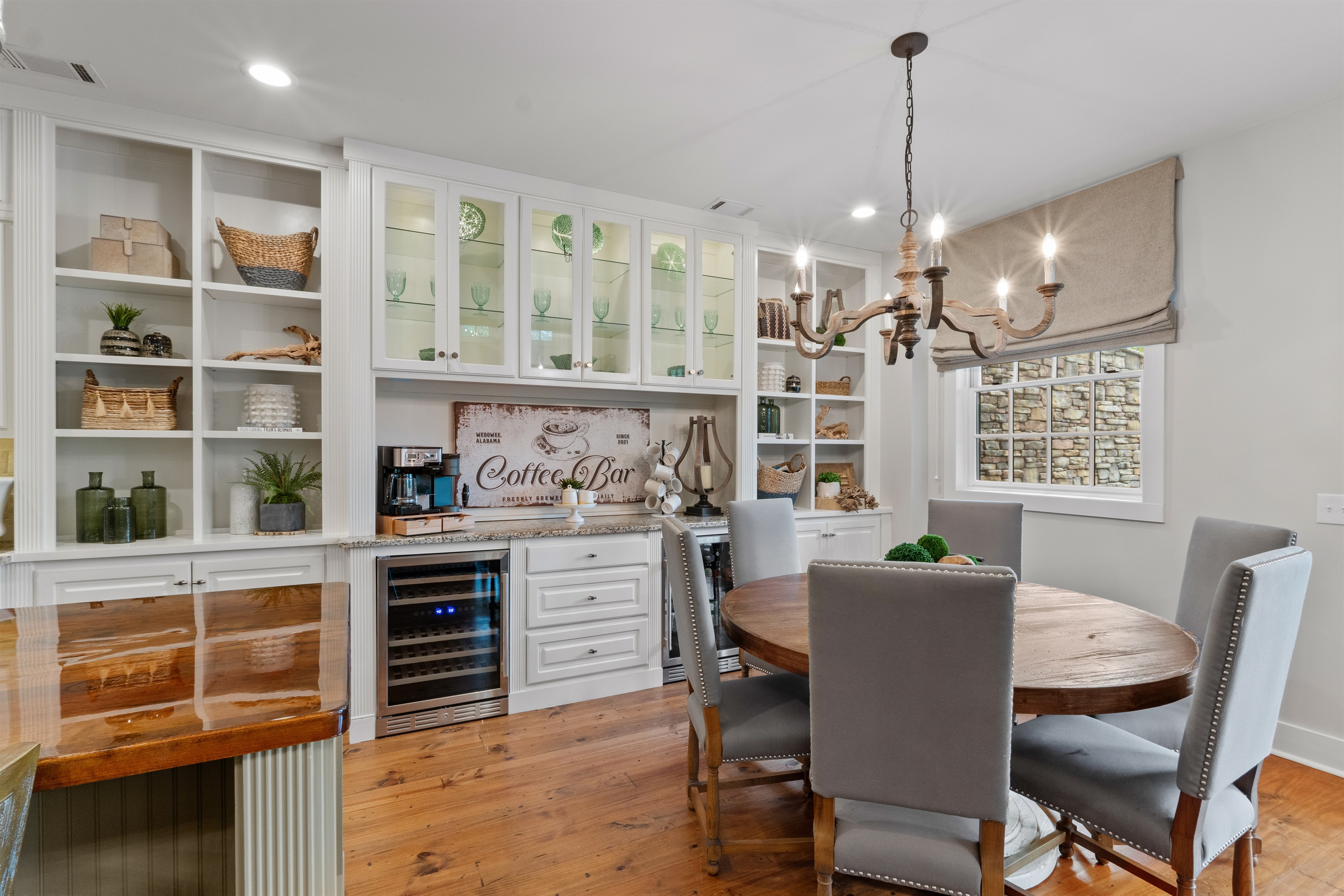 Enjoy a coffee bar with a wine fridge and beverage fridge, perfect for morning brews, evening drinks, and easy entertaining.