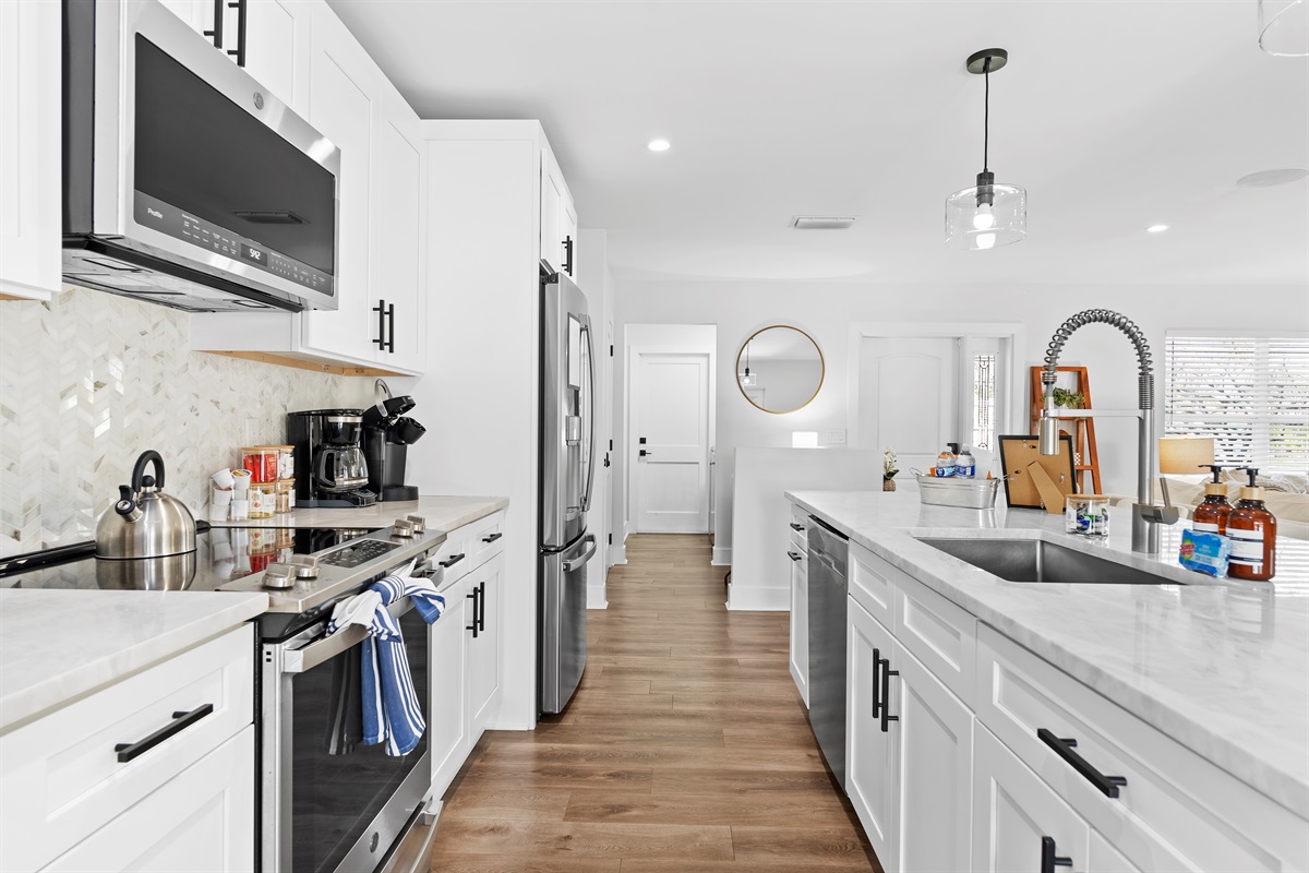 Designed with both beauty and function in mind, this modern kitchen features spacious counters, sleek finishes, and everything needed to cook with ease.