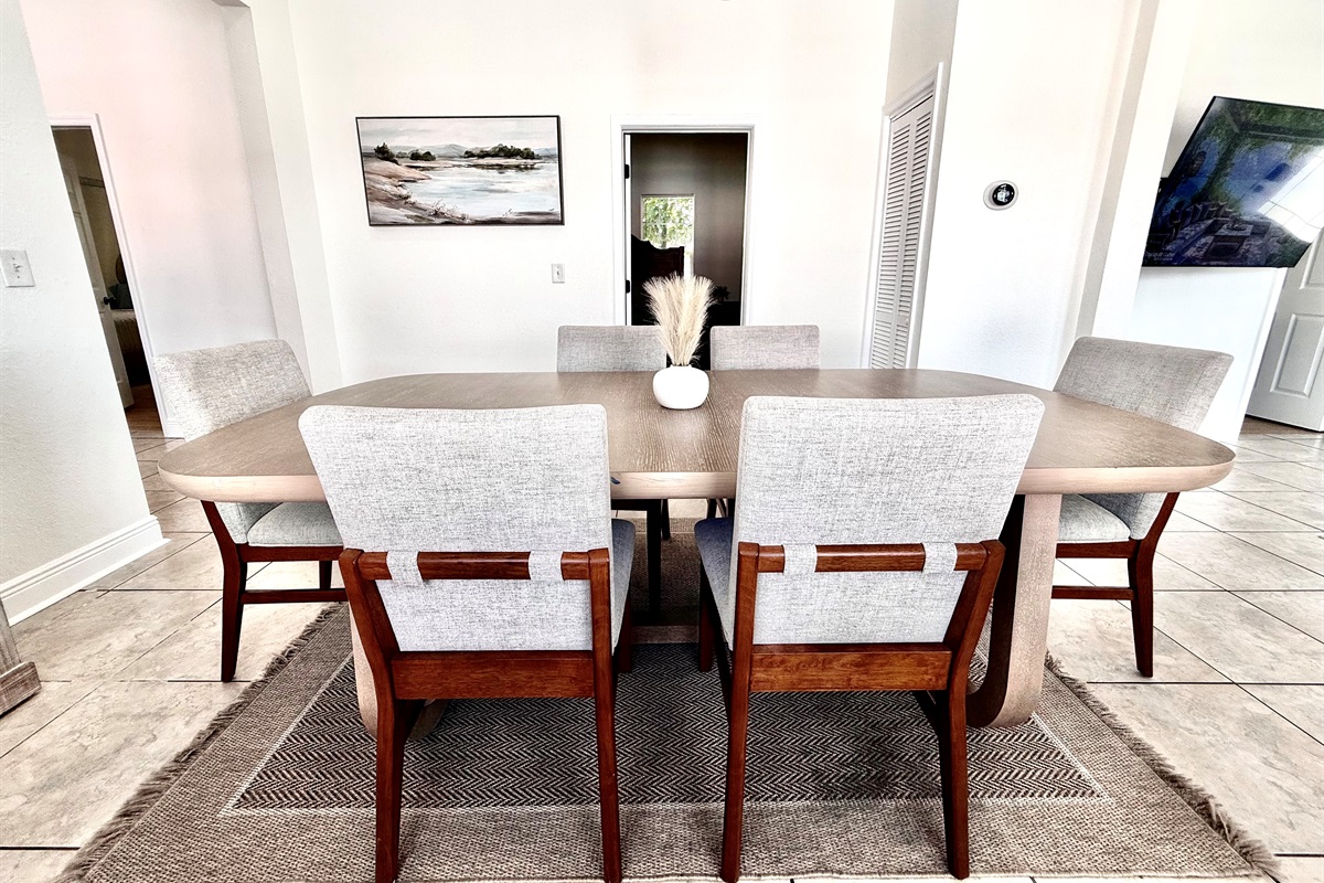 Ideal for families and groups, this dining setup seats 8 comfortably and sits at the heart of the home.