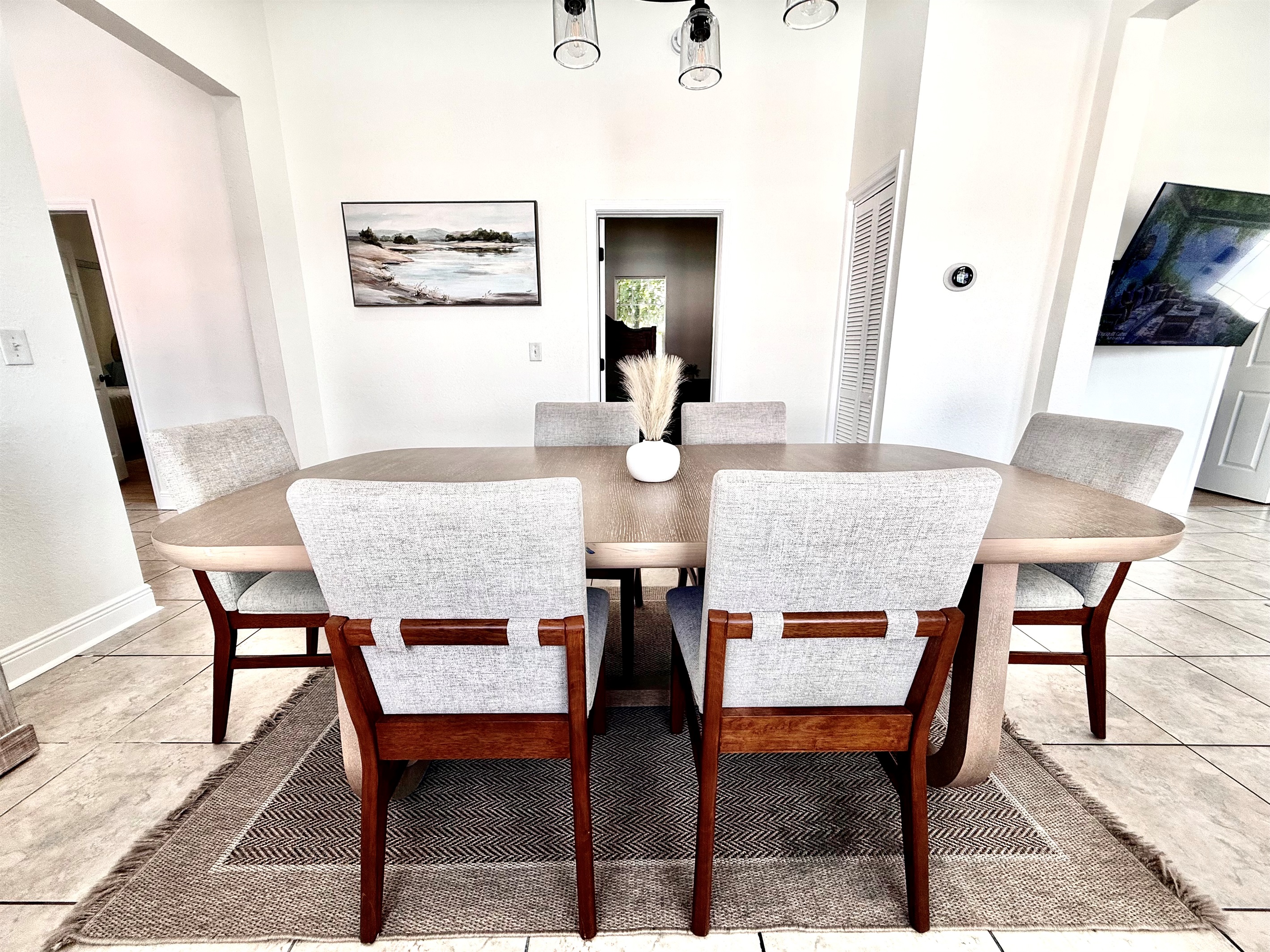 Ideal for families and groups, this dining setup seats 8 comfortably and sits at the heart of the home.