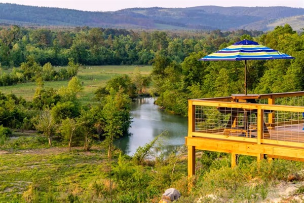 Elevated deck overlooking a wide bend of the Little River—ideal for relaxing, fishing or kayaking.