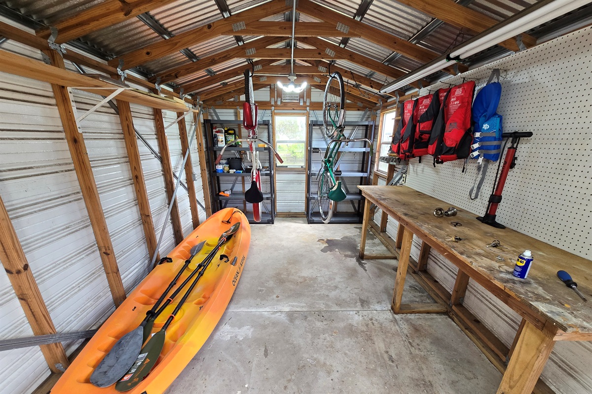 Shed w/ 2 kayaks, One adult 3-person Kayak, and One child (small adult) Kayak, plus life jackets