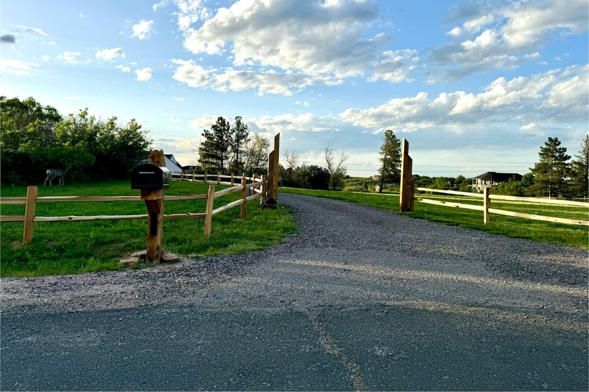 Look for the black mailbox and wooden split rail fence for the entrance to our property.  You may even spot a deer or two (by the trees on the far left).