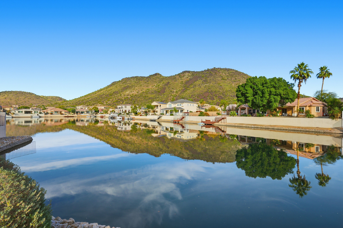 Arrowhead Lakes views with calm water, mountain backdrop, and scenic neighborhood surroundings nearby.