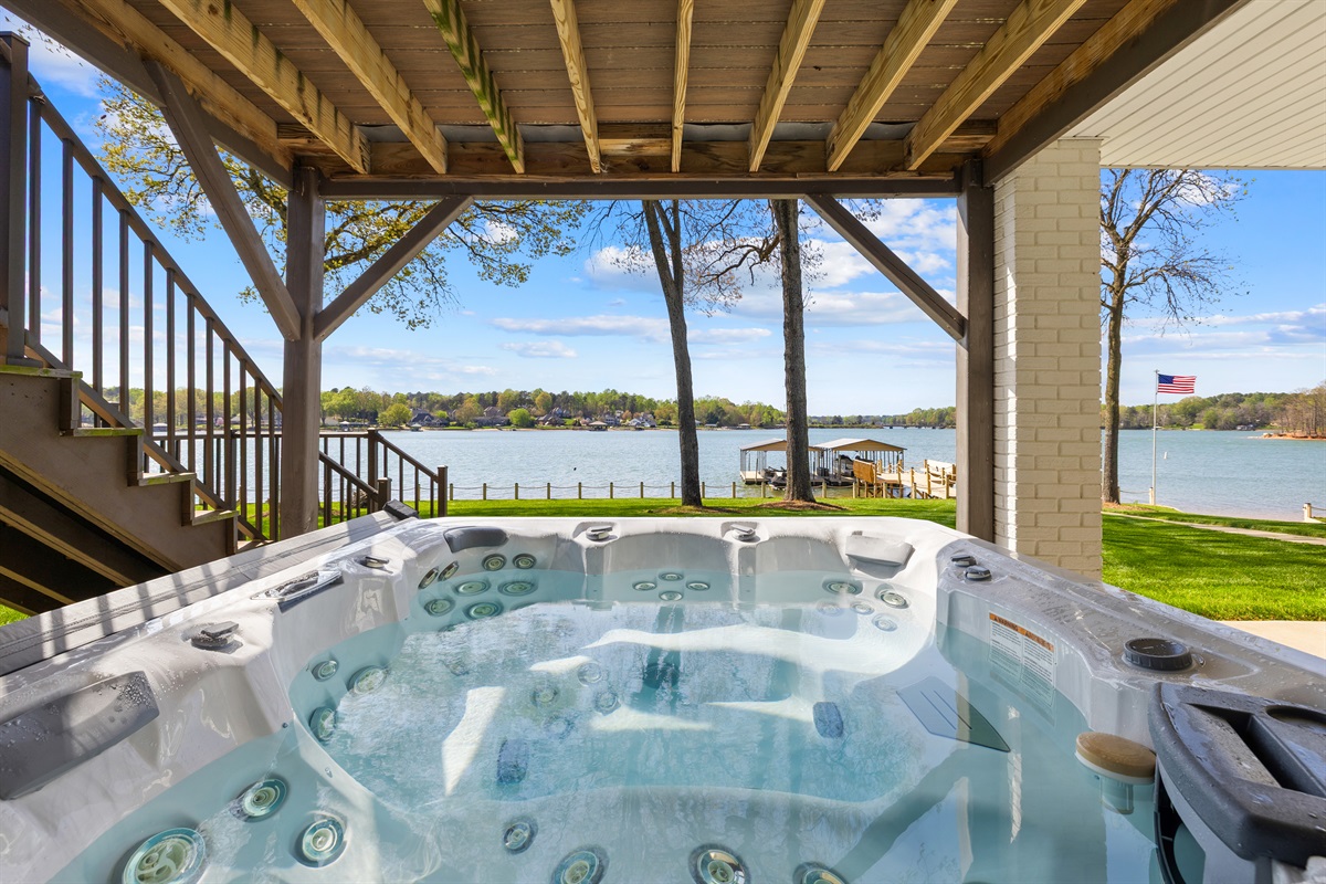 Enjoy lakeside relaxation from the comfort of the hot tub.