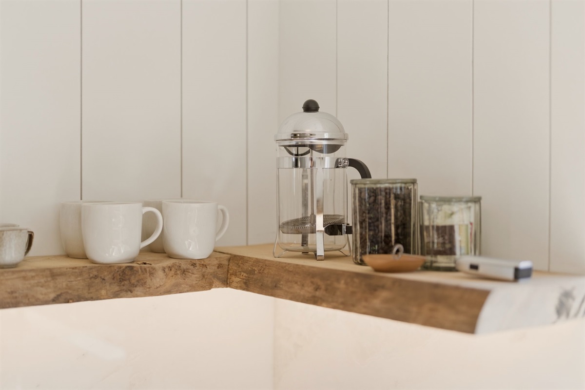 In the Pacific Northwest, coffee is ritual. Wake slowly to peaceful mornings with premium whole-bean coffee and your brewing method of choice—French press, pour-over or Nespresso—plus a grinder, frother, sugar, and cream for the perfect start to your day.