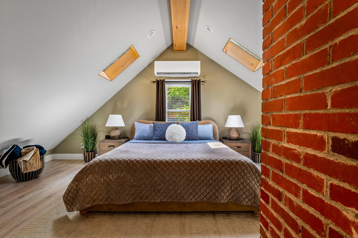 Master Bedroom with King Bed, 42-inch Smart TV, Fireplace, sound machine, blackout curtains and cozy reading chair