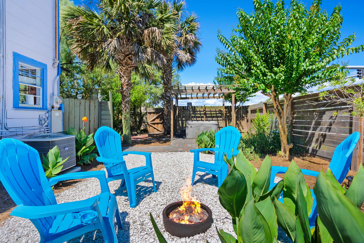 Evenings gather around the fire pit, with the blue Adirondack chairs pulled in close and the gravel still warm underfoot. Somebody always goes back for a blanket, and nobody is ever in a rush to call it a night.