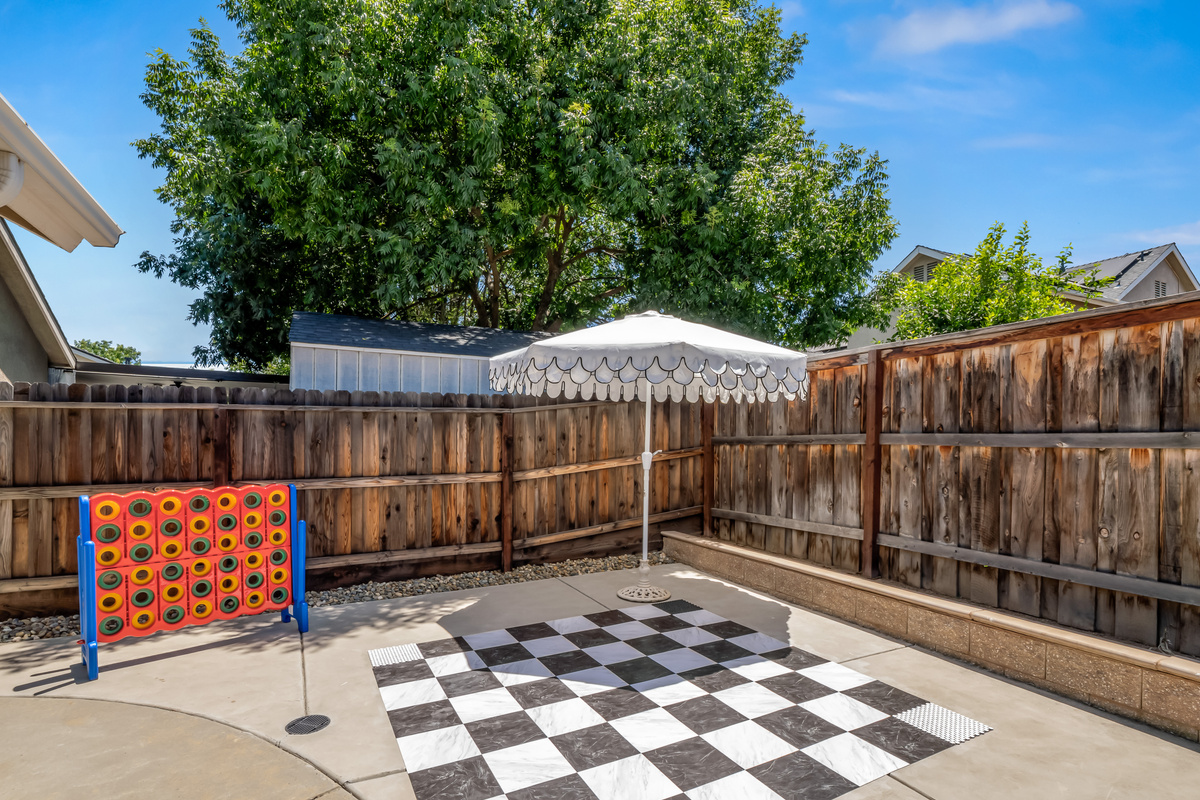 Challenge friends and family to a game of giant Connect Four or oversized checkers in this private backyard entertainment area. A fun outdoor space designed for making vacation memories together.