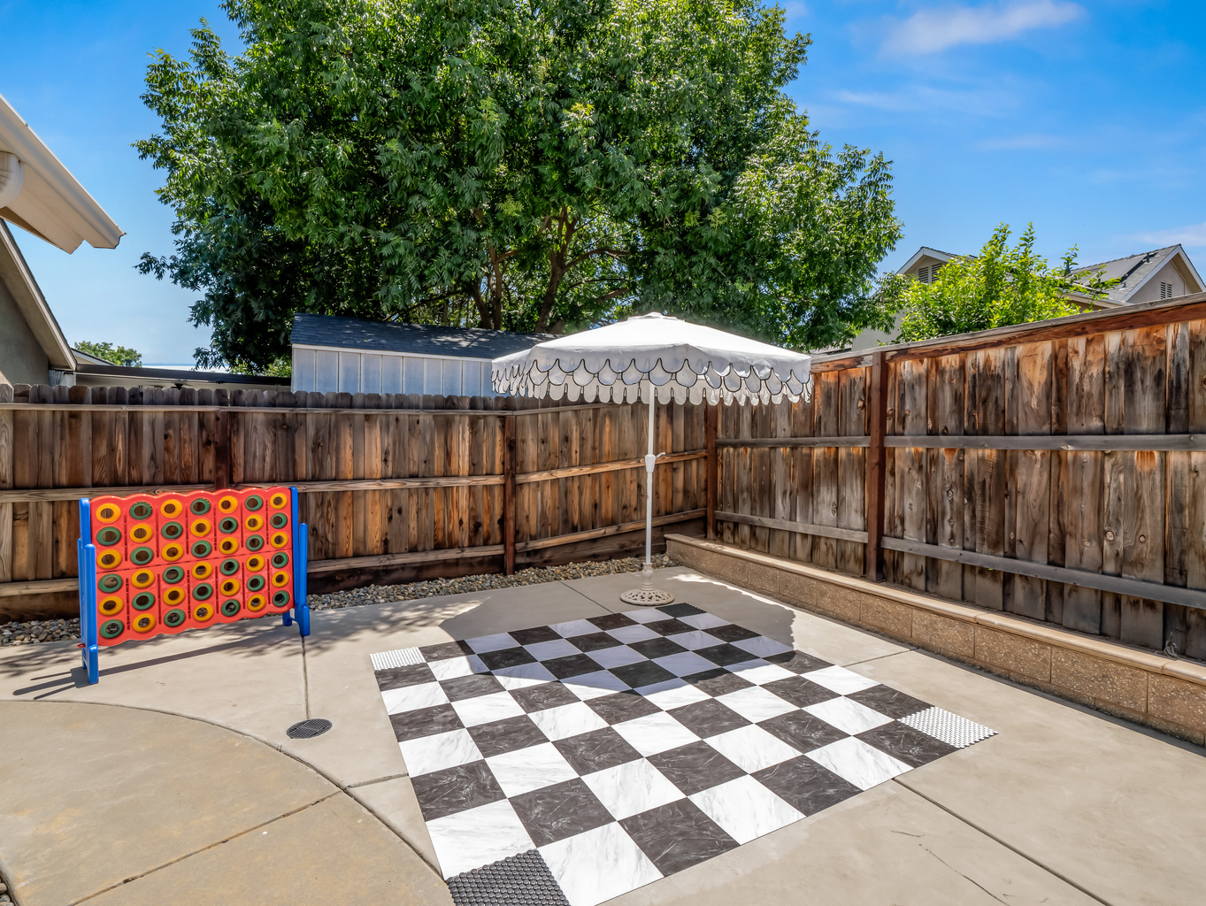 Challenge friends and family to a game of giant Connect Four or oversized checkers in this private backyard entertainment area. A fun outdoor space designed for making vacation memories together.