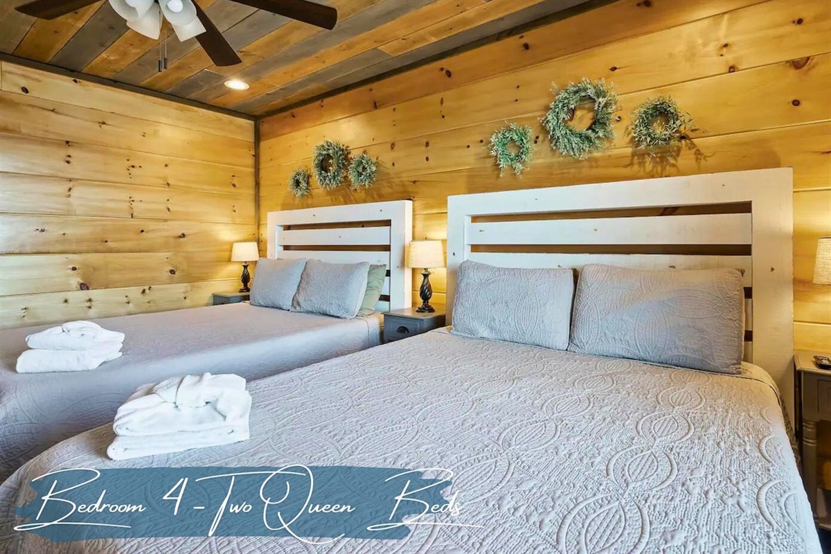 The Bedroom on the Lower Level Features 2 Queen Beds and Charming Decor