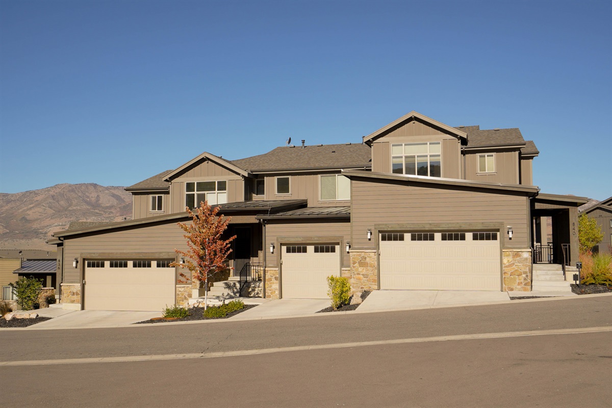 Modern mountain townhome in the Edgewater community with stunning curb appeal and a spacious one-car garage for your use.