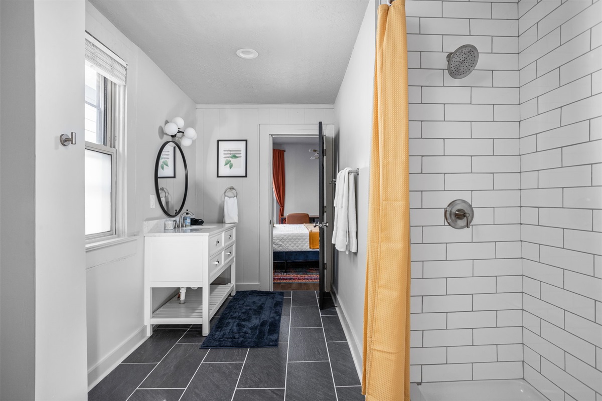Prepare and unwind in the primary en-suite bathroom.
