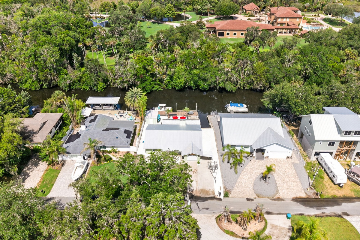 Aerial view of the property and neighborhood