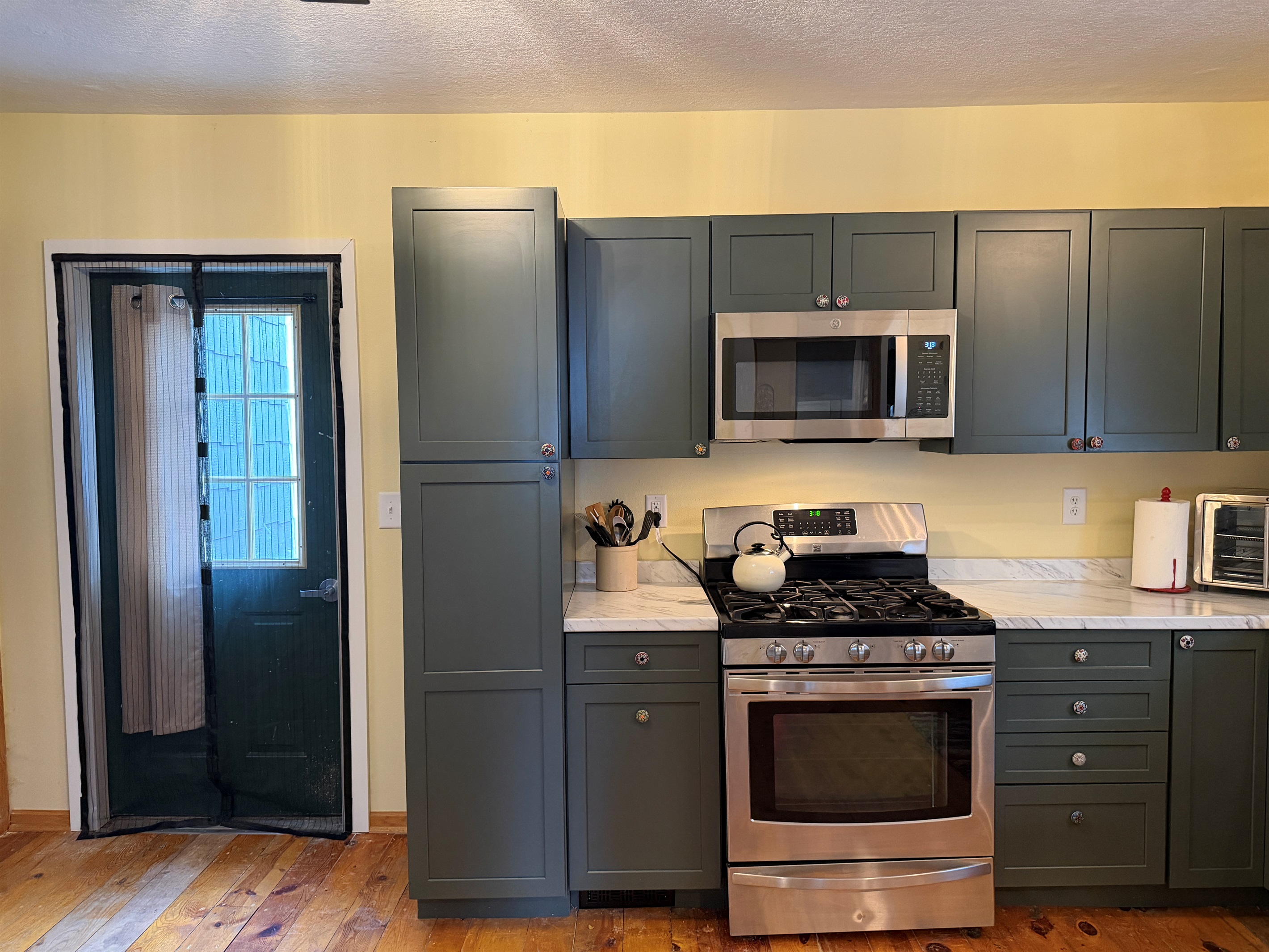 The kitchen leads out to a small patio.